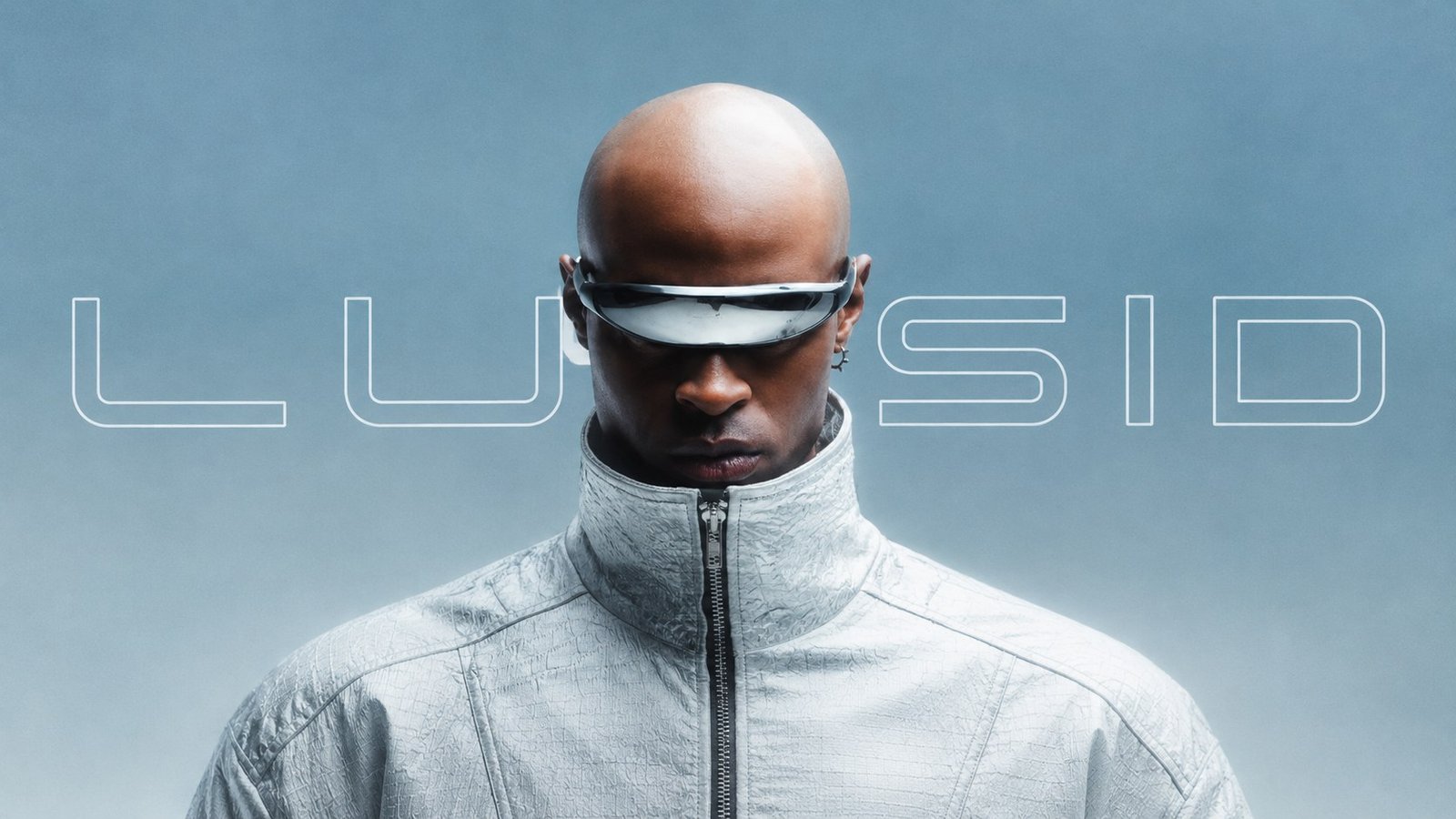 LUSID campaign — model in a silver textured high-collar jacket and chrome visor